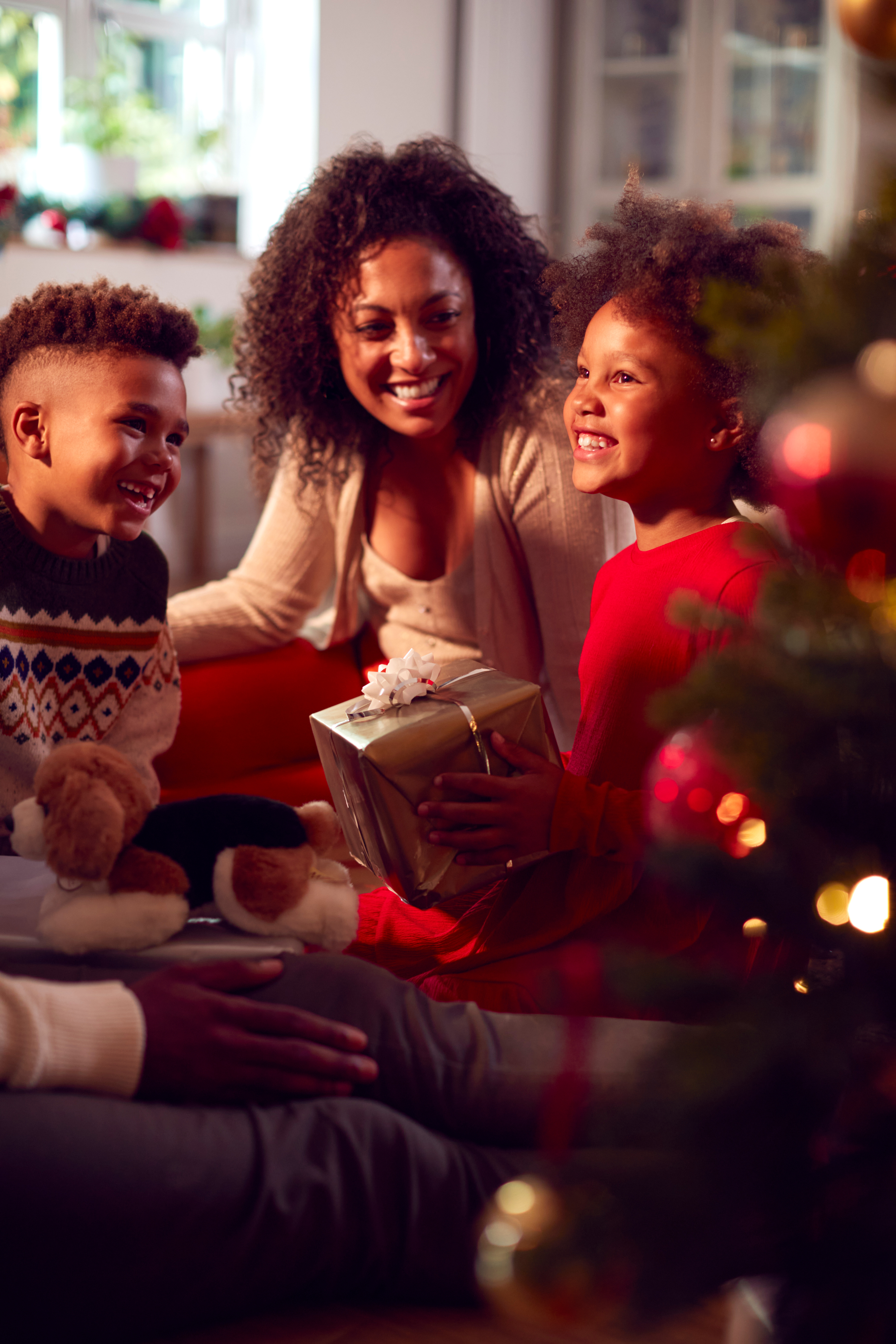 Family opening Christmas gifts together.